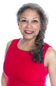 woman with grey hair, in a red dress