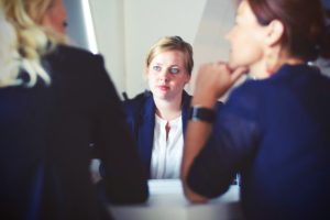 three business women talking