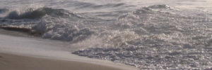 waves dying on the beach
