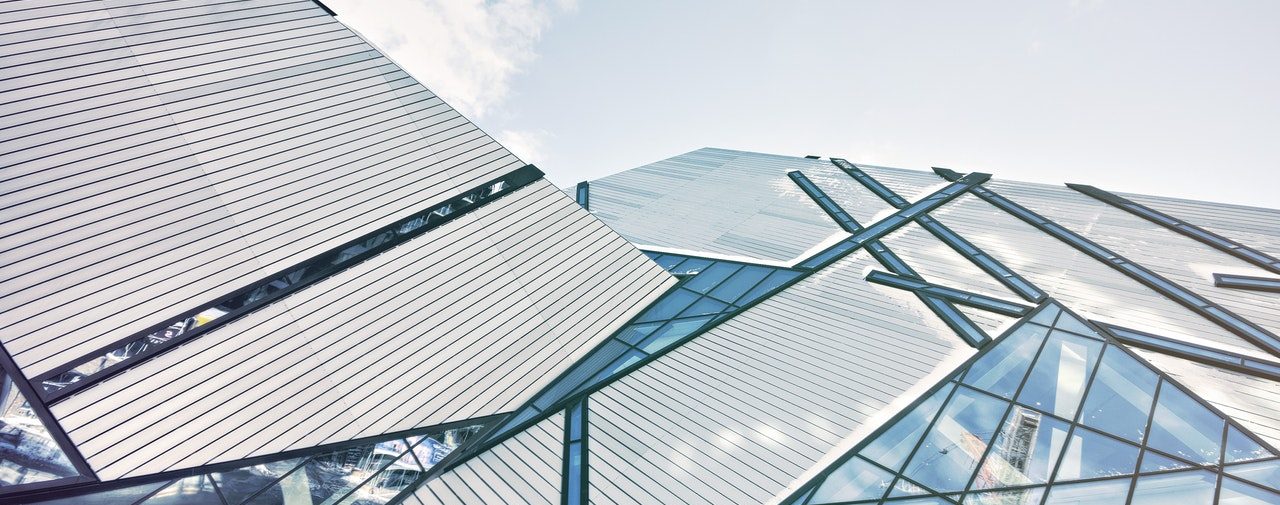 blue glass building and sky